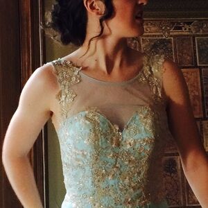 Stunning formal by Faviana glamour. Robins egg Blue, Gold/rinestone lace. Size 2